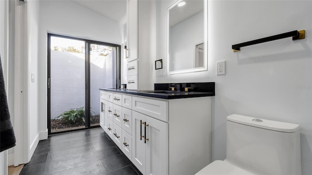 bathroom featuring vanity and toilet