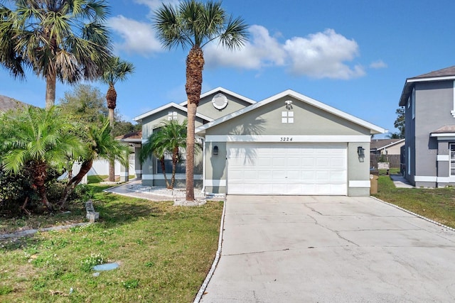 view of front of property with a garage and a front yard