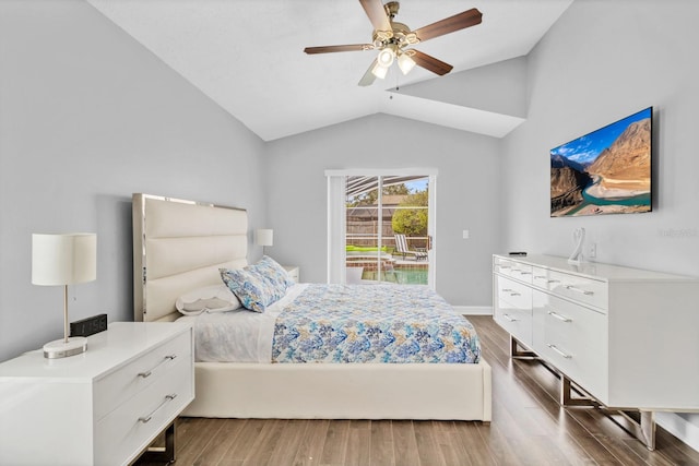 bedroom featuring wood-type flooring, lofted ceiling, access to exterior, and ceiling fan