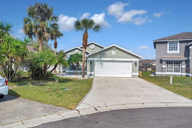 view of front facade with a garage and a front yard