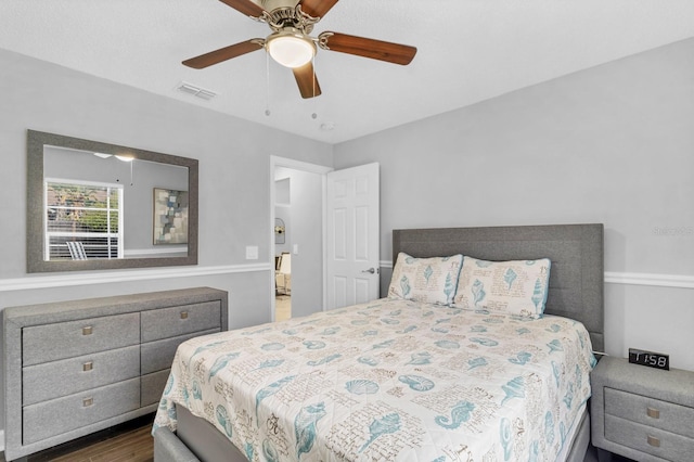 bedroom featuring ceiling fan and dark hardwood / wood-style floors