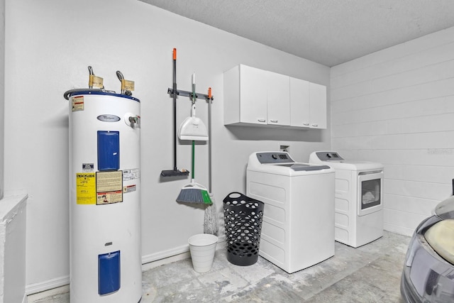 laundry room with cabinets, washer and clothes dryer, water heater, and a textured ceiling