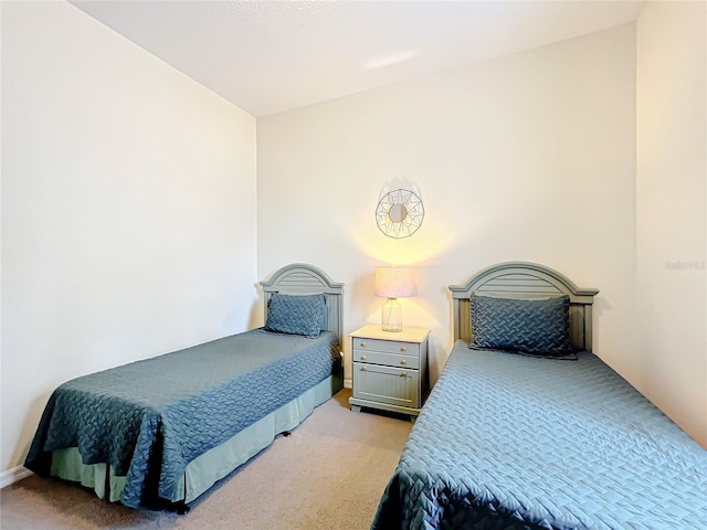 bedroom with light colored carpet