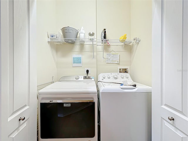 washroom featuring separate washer and dryer