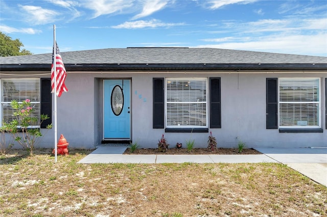 ranch-style house with a front lawn