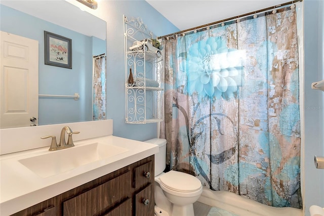 full bathroom featuring vanity, shower / tub combo, and toilet