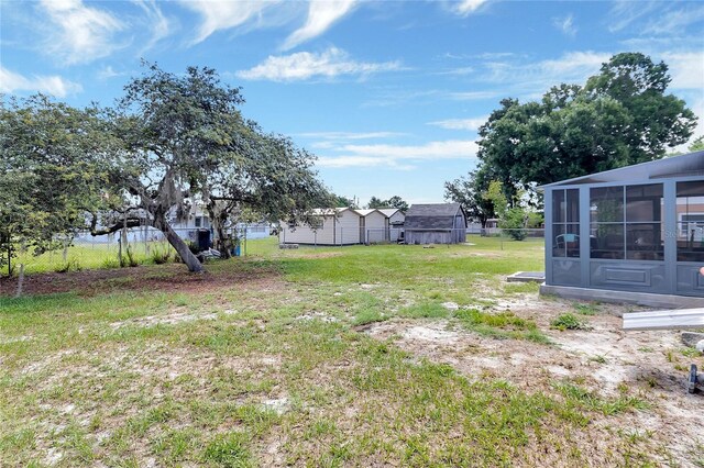 view of yard with a sunroom