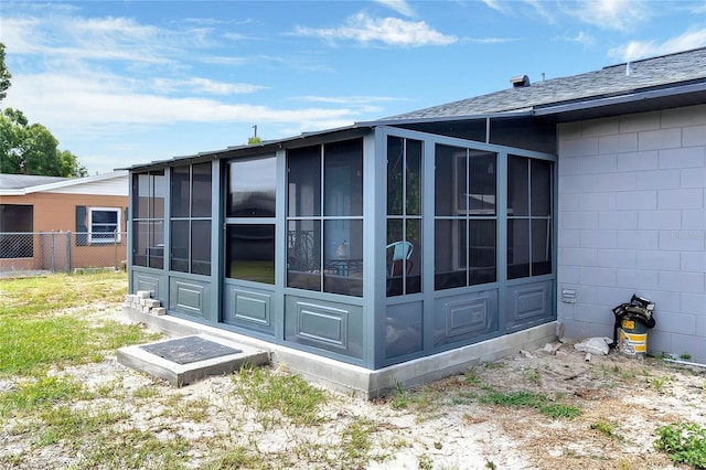 view of side of property featuring a sunroom