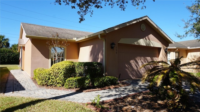 view of side of home with a garage