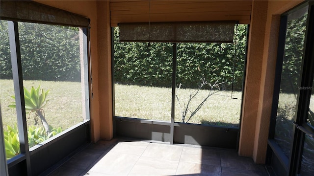 sunroom / solarium featuring a wealth of natural light