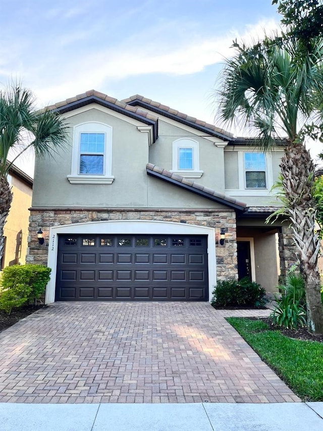 front of property with a garage