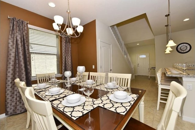 dining room with an inviting chandelier and light tile patterned flooring