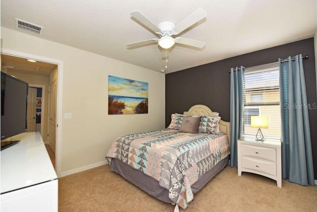 carpeted bedroom featuring ceiling fan