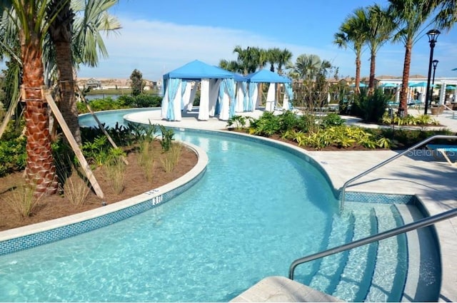 view of swimming pool featuring a gazebo