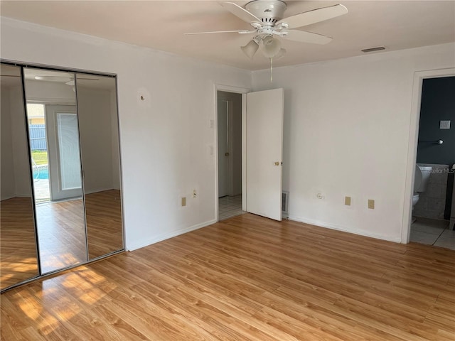 unfurnished room featuring ceiling fan and light hardwood / wood-style flooring