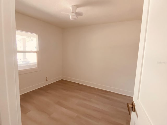 empty room with light hardwood / wood-style flooring