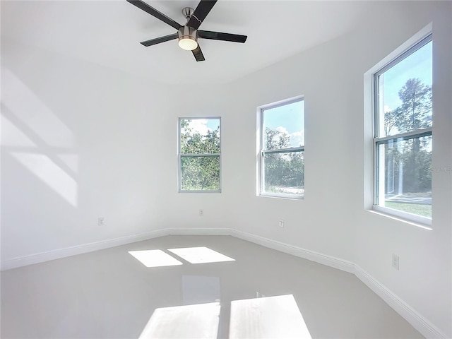 unfurnished room with ceiling fan