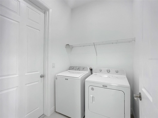 washroom featuring washer and dryer