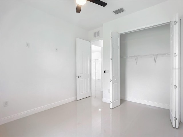 unfurnished bedroom with a closet and ceiling fan