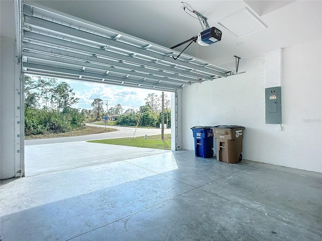 garage featuring a garage door opener and electric panel