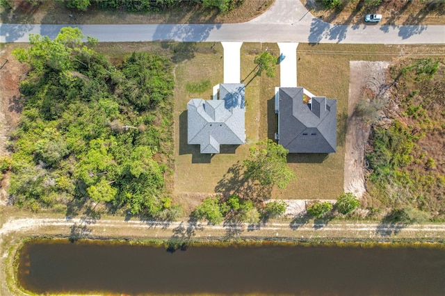 bird's eye view with a water view