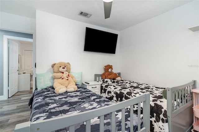 bedroom featuring hardwood / wood-style floors and ceiling fan