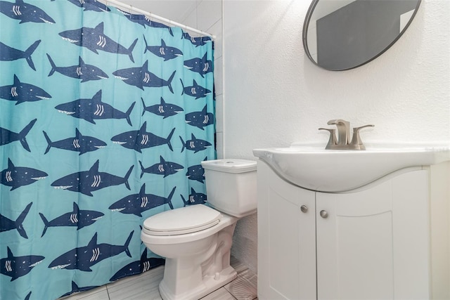 bathroom featuring vanity, toilet, and a shower with shower curtain