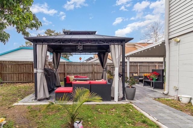 view of patio featuring a gazebo and outdoor lounge area