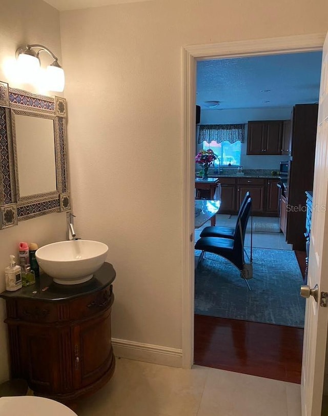 bathroom with tile patterned floors and vanity