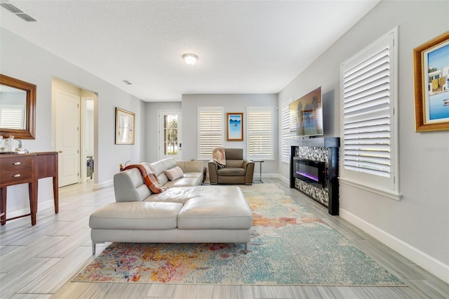 living room with light hardwood / wood-style flooring