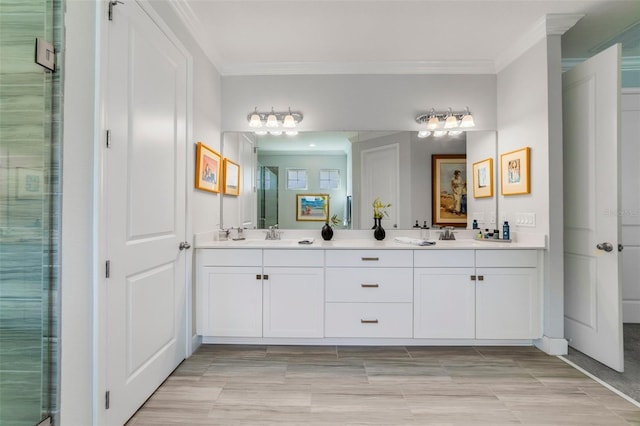 bathroom with an enclosed shower, ornamental molding, and vanity