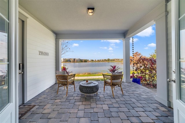 view of patio / terrace with a water view