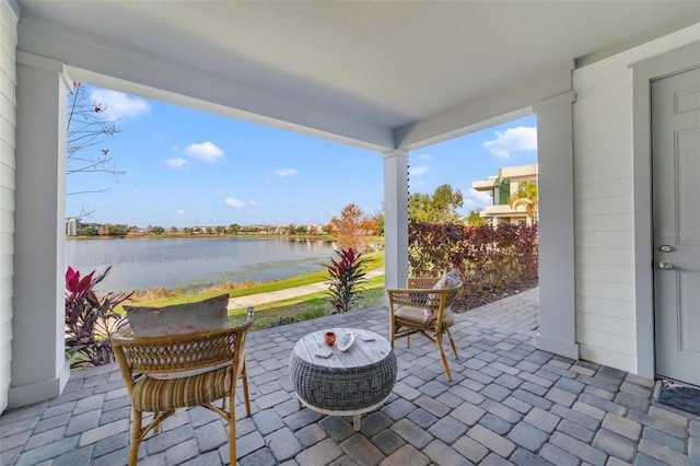 view of patio / terrace with a water view