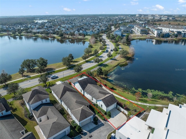 bird's eye view with a water view