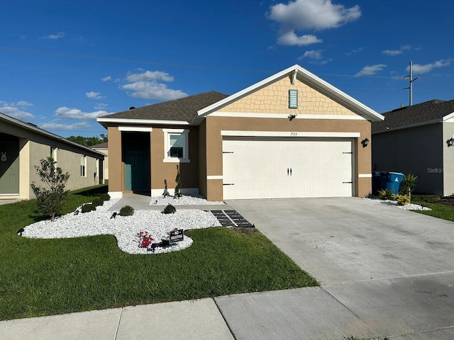 view of front of property with a garage and a front yard