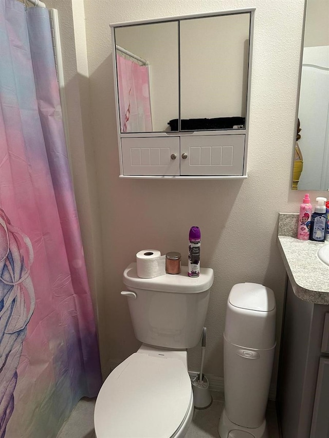 bathroom featuring vanity and toilet