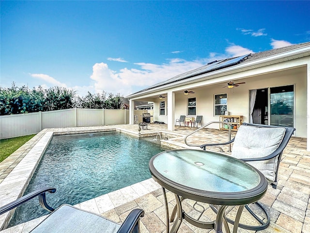 view of swimming pool with a patio area and ceiling fan