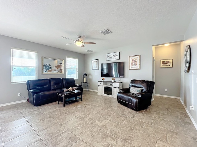 3857 San Isidro Cir, Saint Cloud, FL 34772 - living room with ceiling fan and a textured ceiling