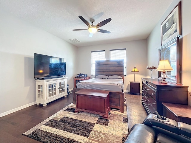 3857 San Isidro Cir, Saint Cloud, FL 34772 - bedroom with ceiling fan, a textured ceiling, and dark hardwood / wood-style flooring