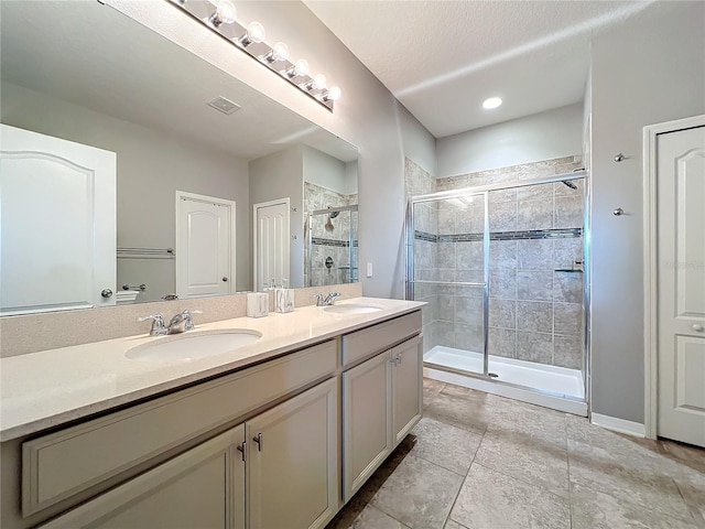 3857 San Isidro Cir, Saint Cloud, FL 34772 - bathroom featuring vanity, an enclosed shower, and a textured ceiling