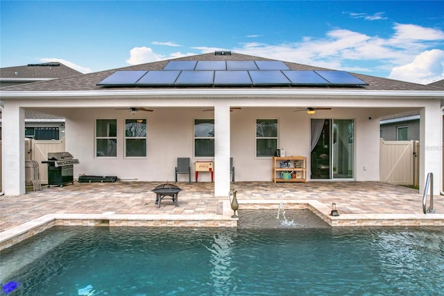 3857 San Isidro Cir, Saint Cloud, FL 34772 - rear view of house with a patio, ceiling fan, and an outdoor fire pit