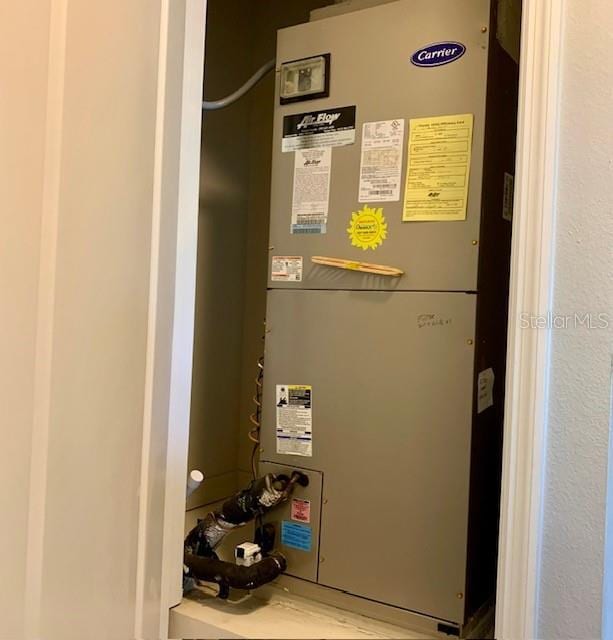 3857 San Isidro Cir, Saint Cloud, FL 34772 - utility room featuring heating unit