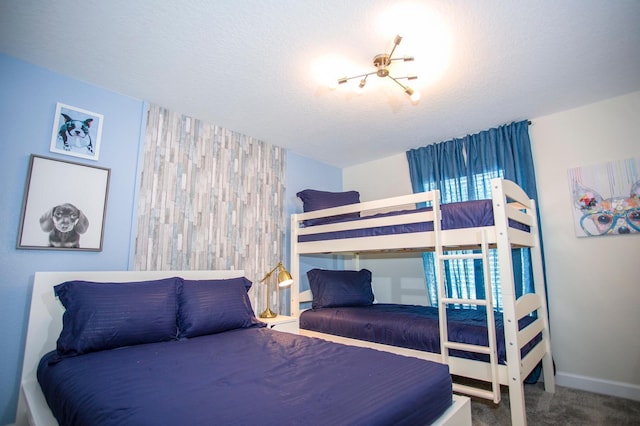 carpeted bedroom with a textured ceiling