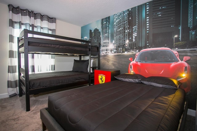 carpeted bedroom featuring a textured ceiling