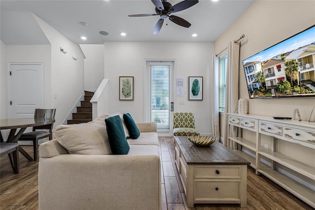 living room featuring ceiling fan and wood-type flooring