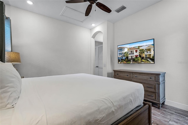 bedroom with ceiling fan and wood-type flooring