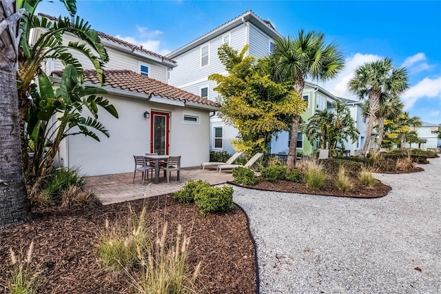 rear view of house with a patio