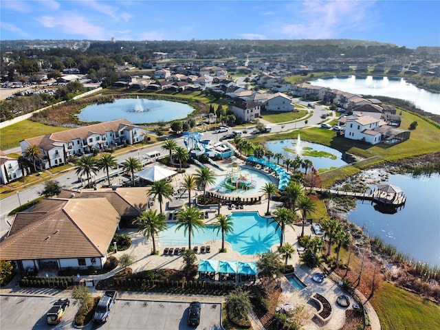 birds eye view of property with a residential view and a water view