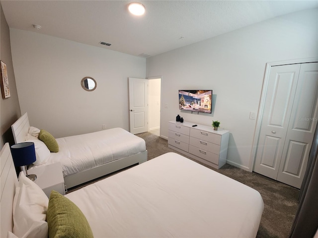 carpeted bedroom featuring a closet