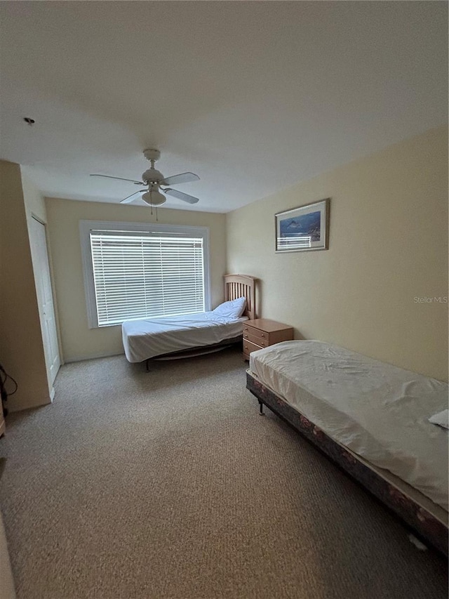 carpeted bedroom with ceiling fan